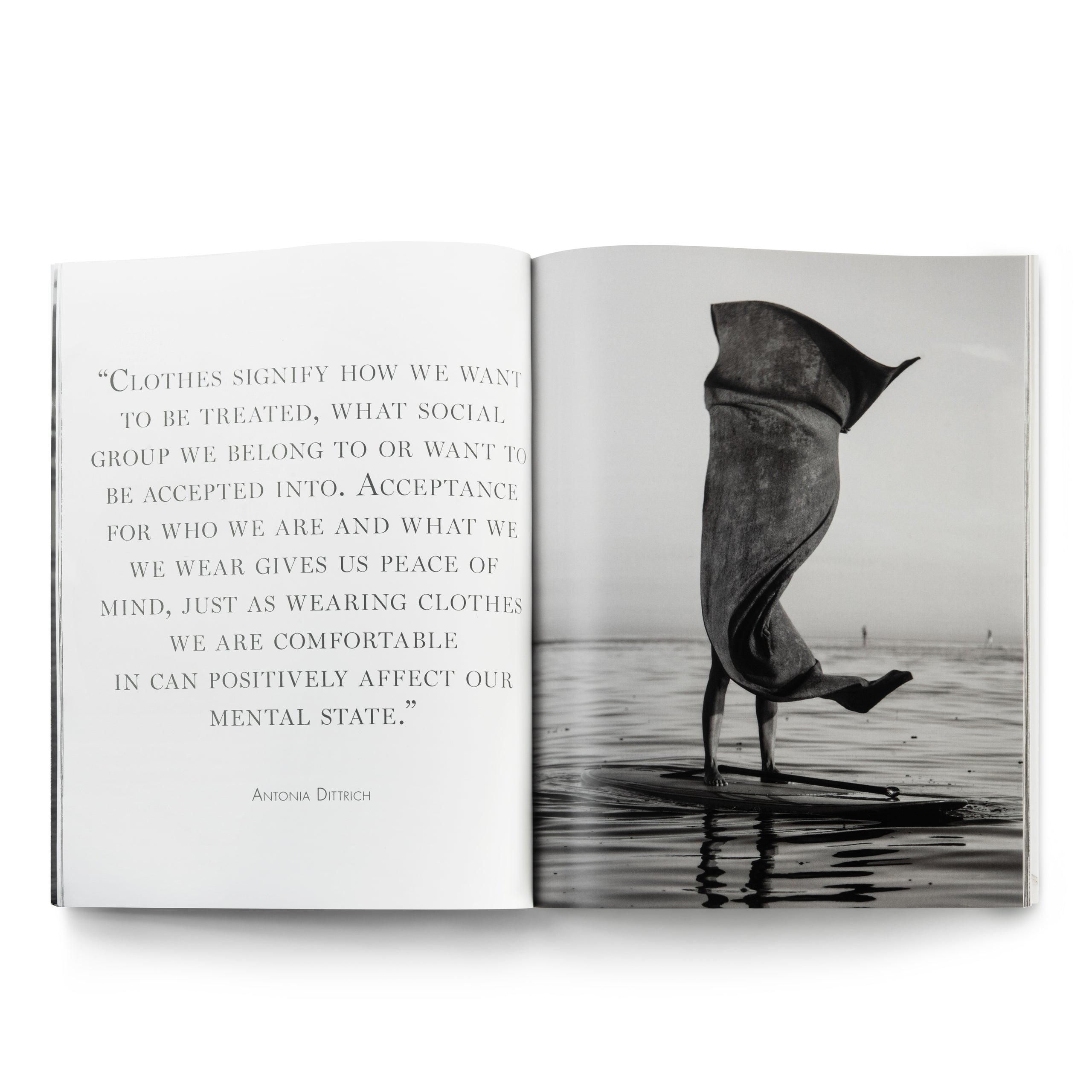 Open book with quote and person on paddleboard.