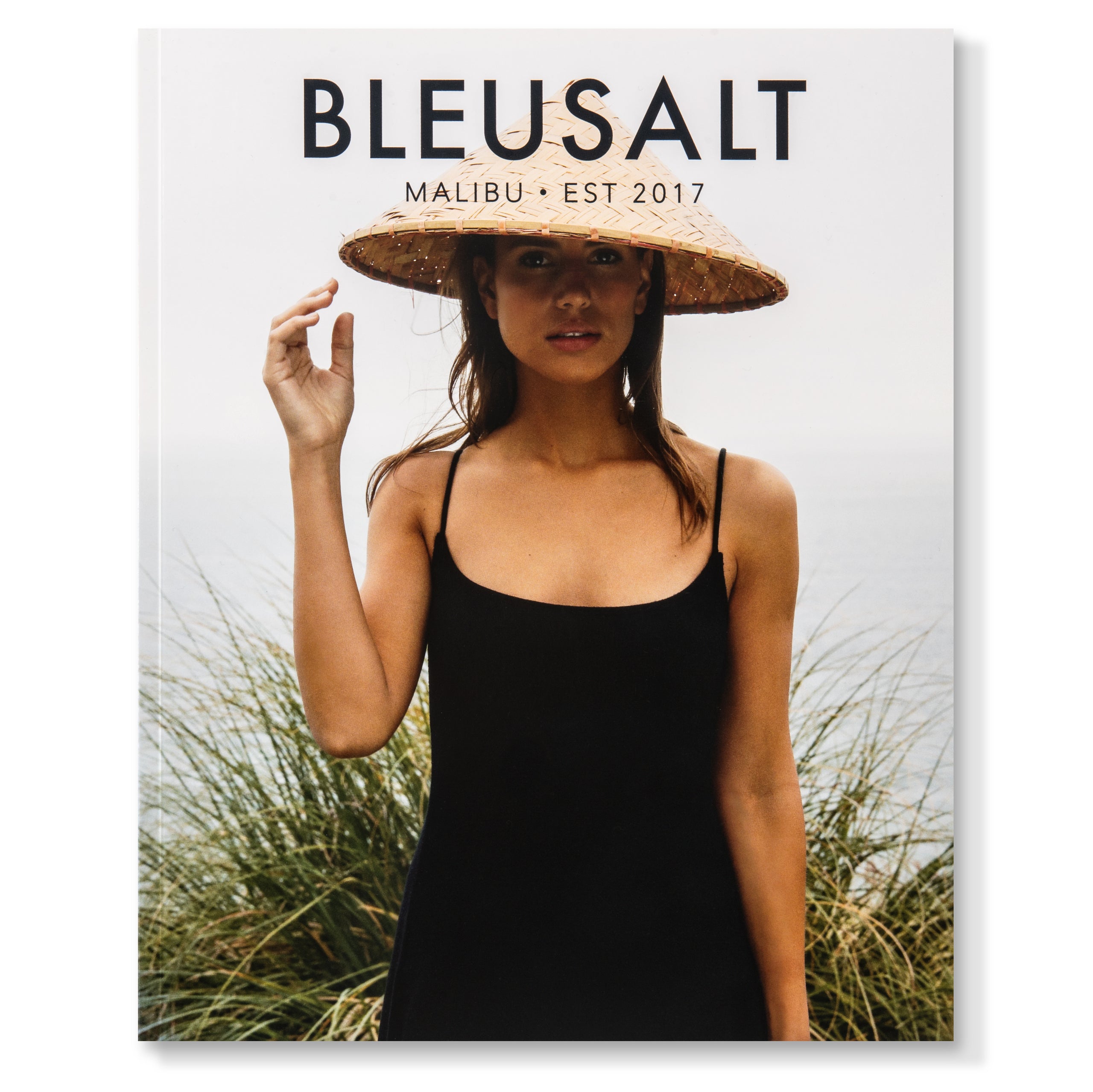 Woman in black dress with straw hat.