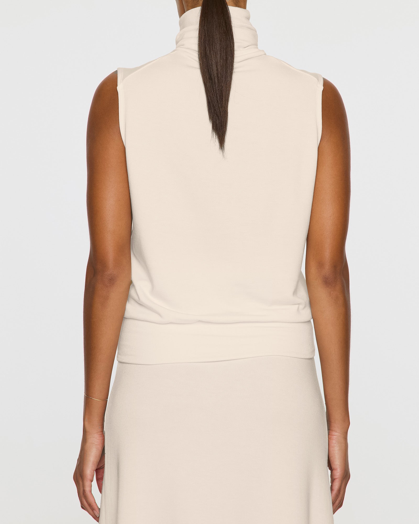 Stone | The Sleeveless Turtleneck Back