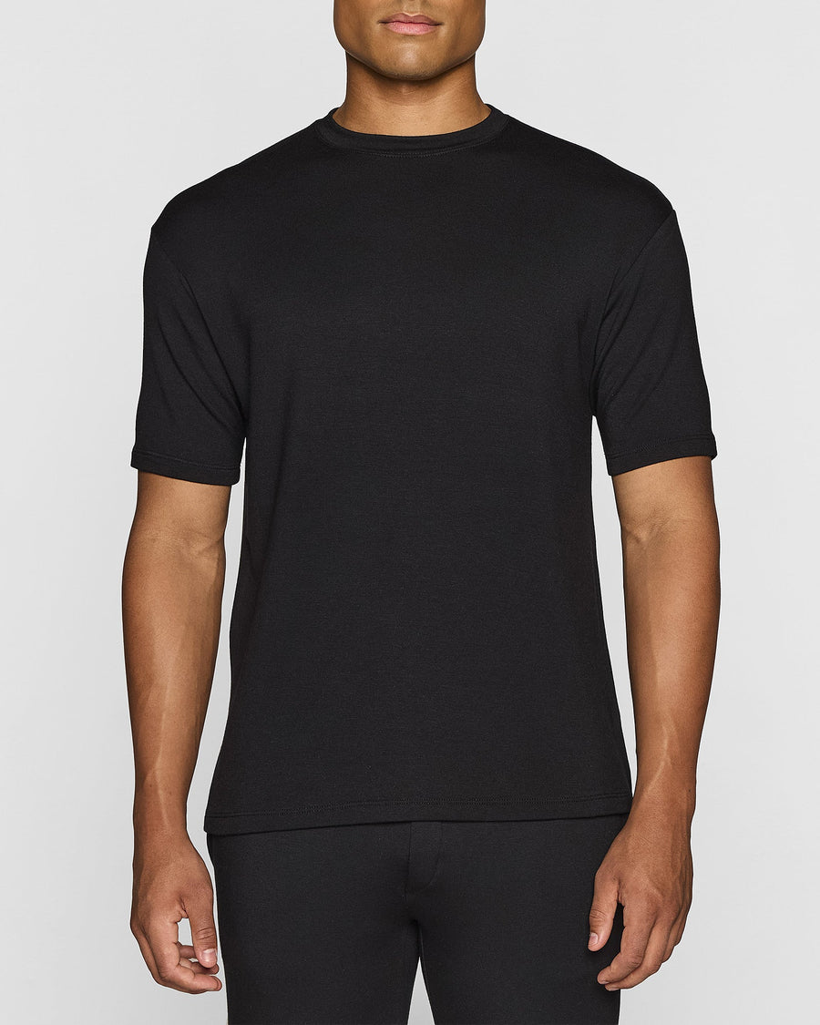 Man wearing a black Bleusalt T-shirt in a capsule wardrobe look
