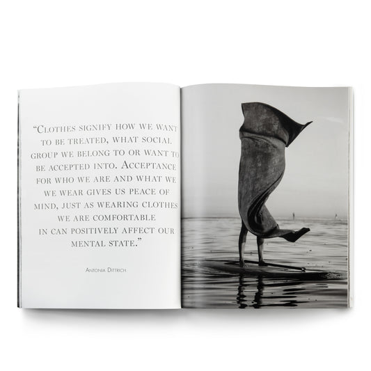 Open book with quote and person on paddleboard.