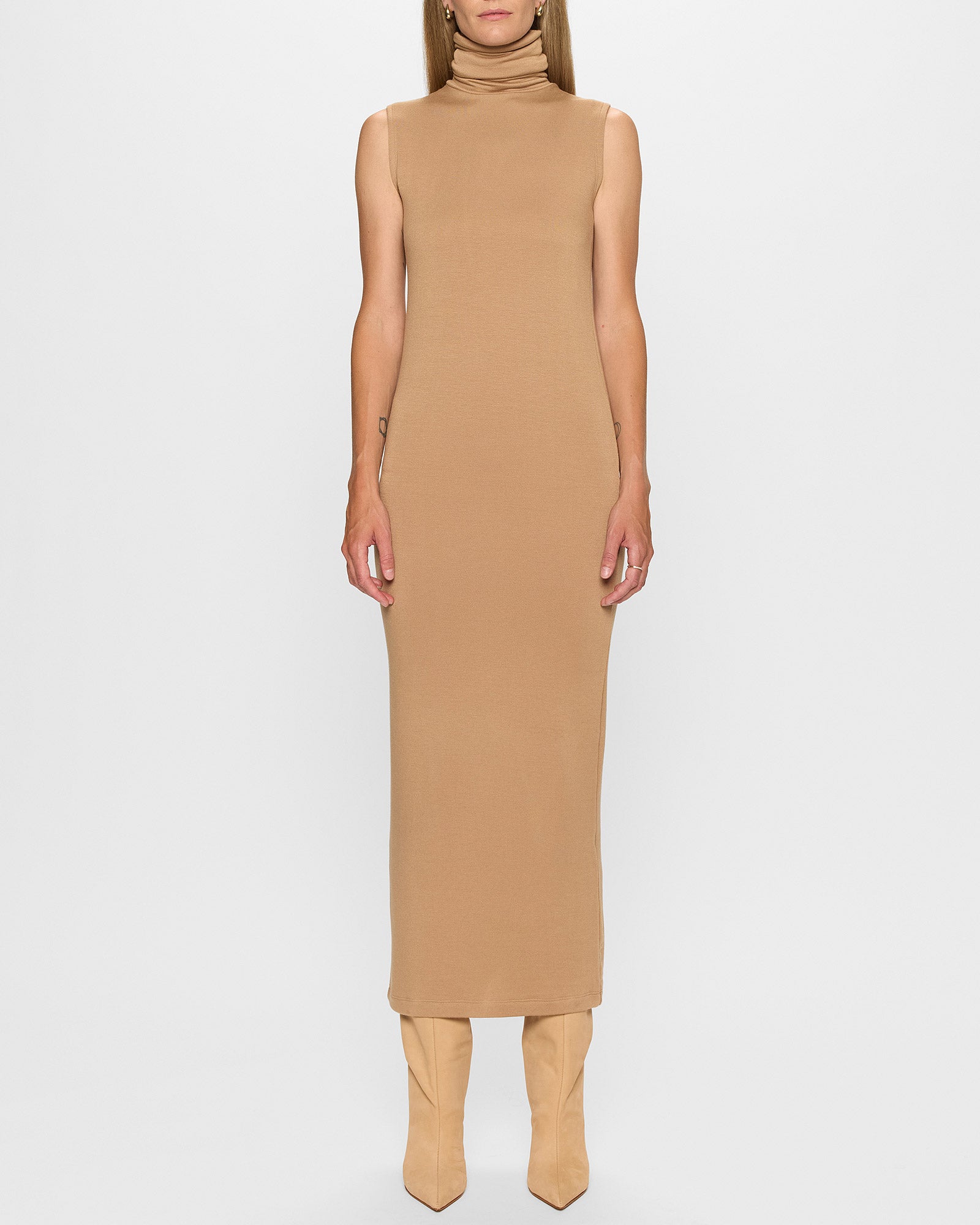 sleeveless turtleneck dress Stretchy turtleneck dress with no closures.Model is wearing a medium. NICHOLAS Kiandra Sleeveless Turtleneck Knit
