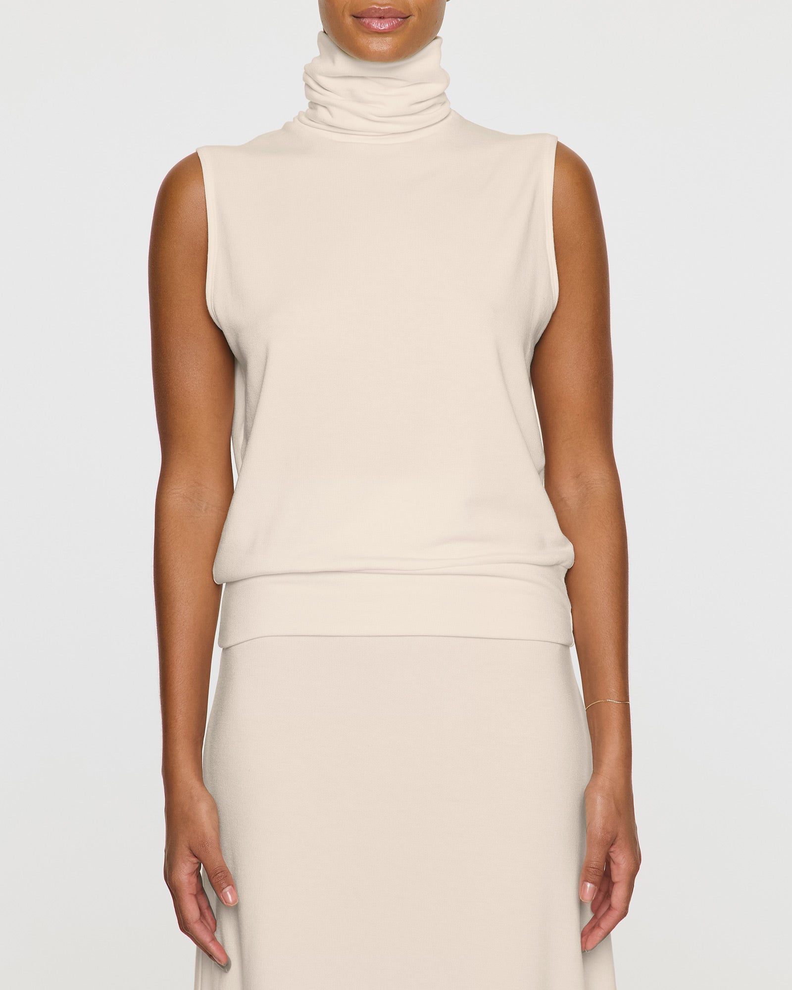 Stone | The Sleeveless Turtleneck Front